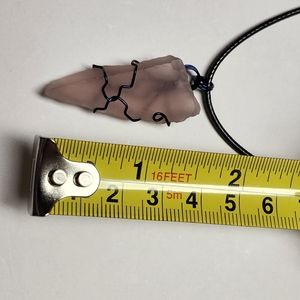 Handmade wire wrap glass pendant with cord.